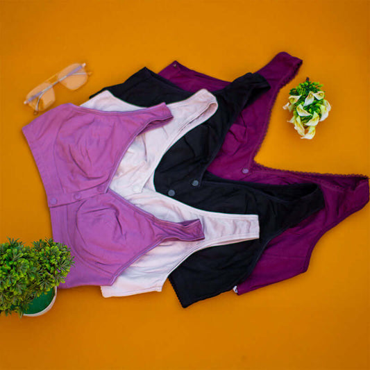 Wide strap nursing bras in pink, black, and purple colors on an orange background, designed for comfort and breastfeeding.