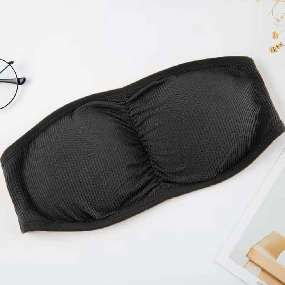 Free size black bandeau bra with three back straps, removable padding, and ribbed stretchable fabric.