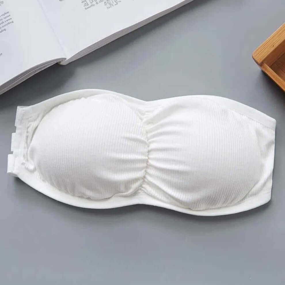 Free size white bandeau bra with three back straps, removable padding, and ribbed stretchable fabric.