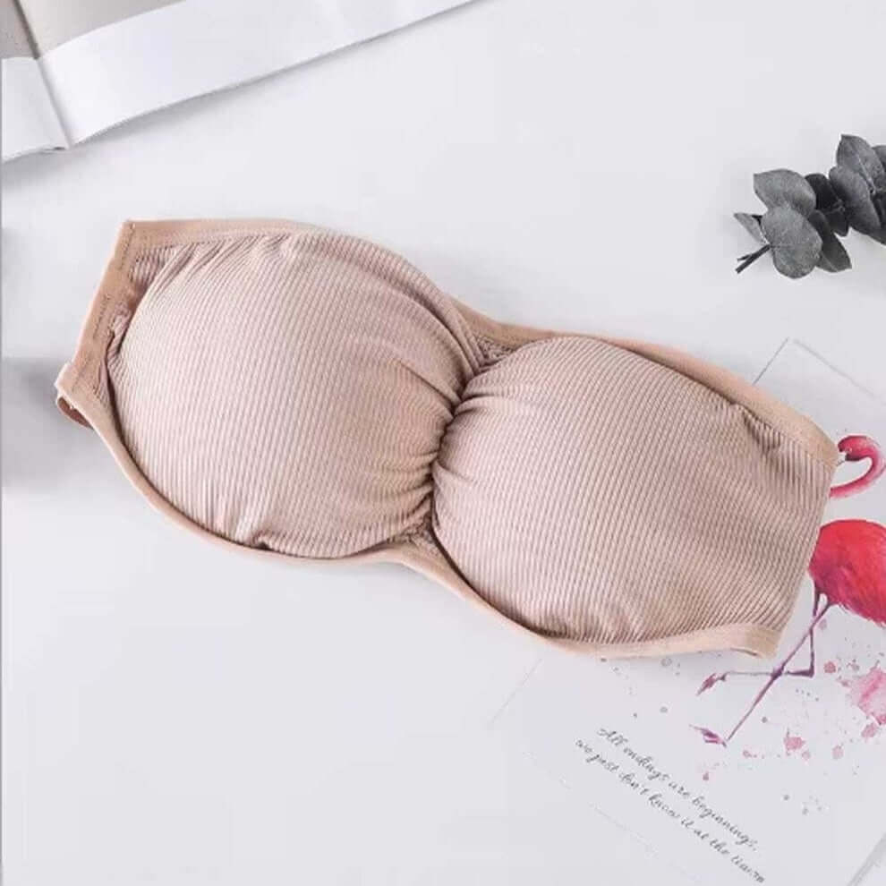 Free size beig bandeau bra with three back straps, removable padding, and ribbed stretchable fabric.